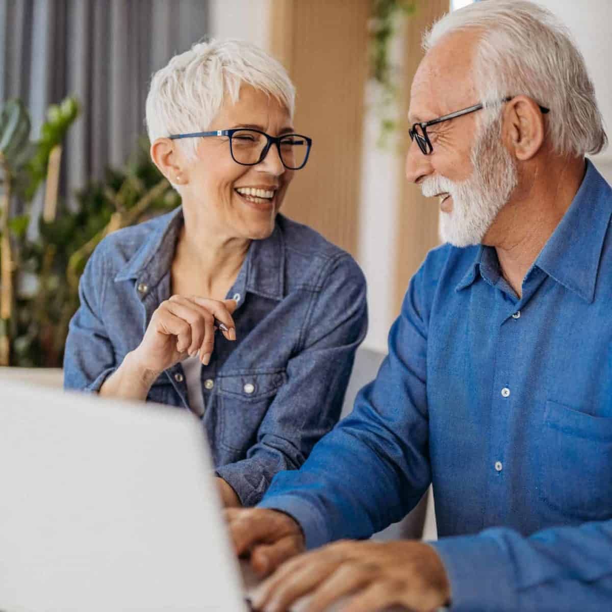 Michigan Precious Metals IRA & Investing Company Copy of Senior couple at laptop smiling GettyImages 1323096524 1200x1200 1